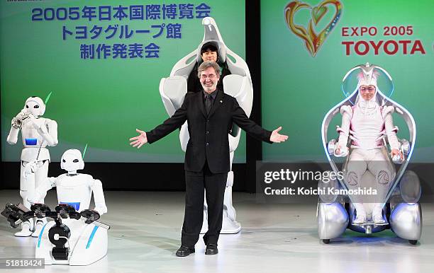 Yves Pepin, Producer/Show Director of "EXPO 2005 AICHI" poses next to the companies newly developed prototype of a rolling robot during a press...