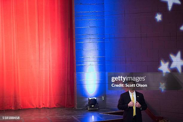 Secret Service agent keeps watch over the crowd at a rally with Republican presidential candidate Donald Trump at St. Norbert College on March 30,...