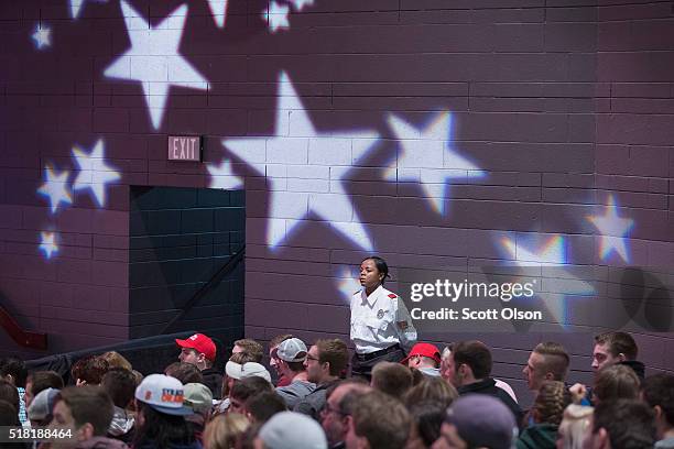 Security guard keeps watch over the crowd at a rally with Republican presidential candidate Donald Trump at St. Norbert College on March 30, 2016 in...