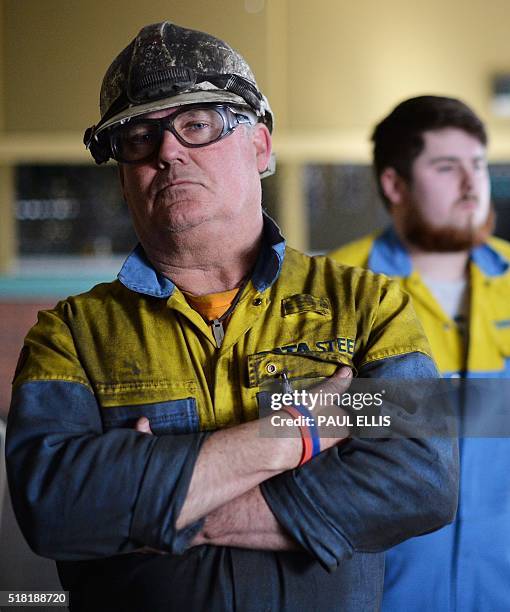 Tata Steel workers listen to British opposition Labour Party leader Jeremy Corbyn speaking at the Tata sports and social club close to the company's...