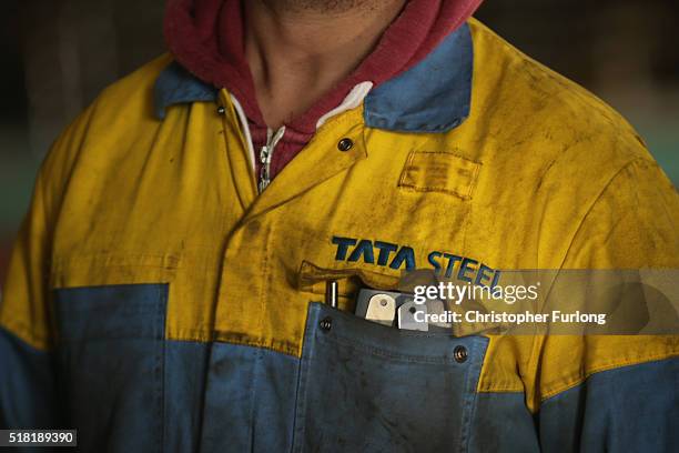 Workers from the Tata Steel plant listen to labour leader Jeremy Corbyn speak to workers and union members at the Tata Sports Club on March 30, 2016...