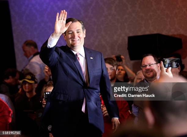 Republican Presidential candidate Senator Ted Cruz waves to guest at a town hall event called "Women for Cruz" Coalition Rollout with wife Heidi,...