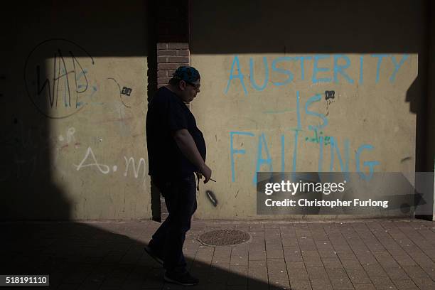 Man walks through Port Talbot near the Tata Steel plant on March 30, 2016 in Port Talbot, Wales. Indian owners Tata Steel put its British business up...