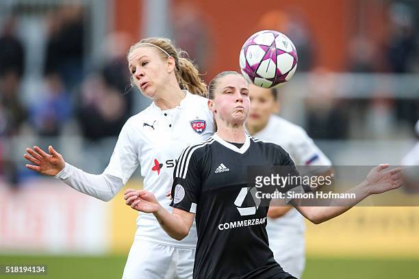 Ana-Maria Crnogorcevic of Frankfurt is challenged by Katrin Schmidt of Rosengard during the UEFA Women's Champions League quarter final second leg...