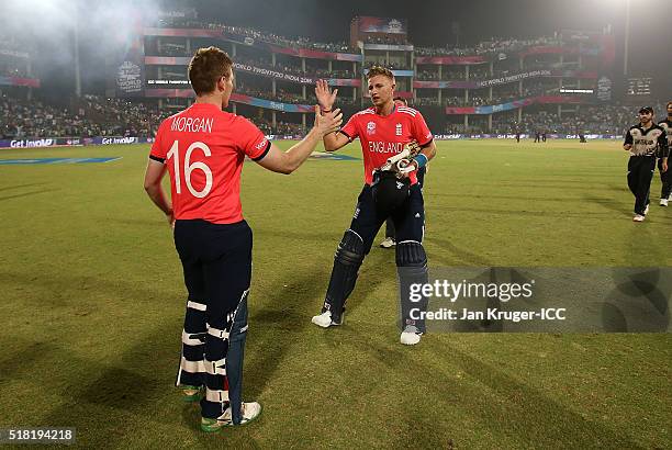 Eoin Morgan, Captain of England celebrates with Joe Root during the ICC World Twenty20 India 2016 Semi-Final match between England and New Zealand at...