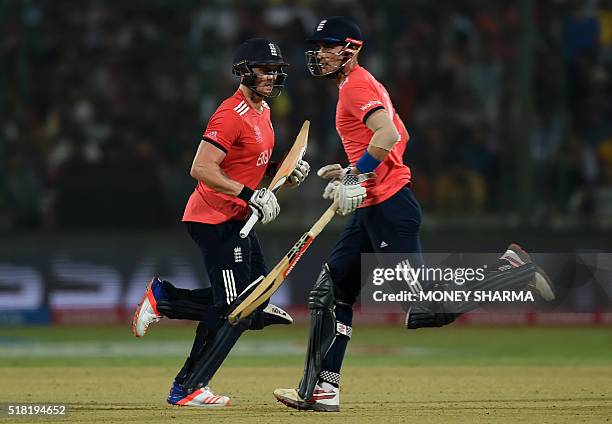 England's Alex Halesand Jason Roy run between the wickets during the World T20 cricket tournament semi-final match between England and New Zealand at...