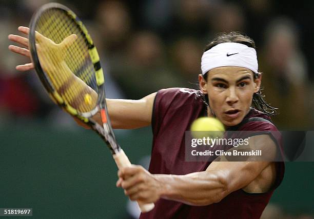 Rafael Nadal of Spain plays a backhand during his match against Andy Roddick of the USA in the second rubber during the Davis Cup by BNP...