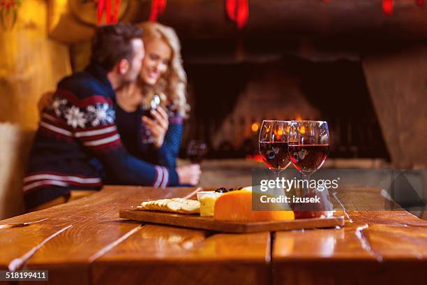 wine and cheese - log fire stock pictures, royalty-free photos & images