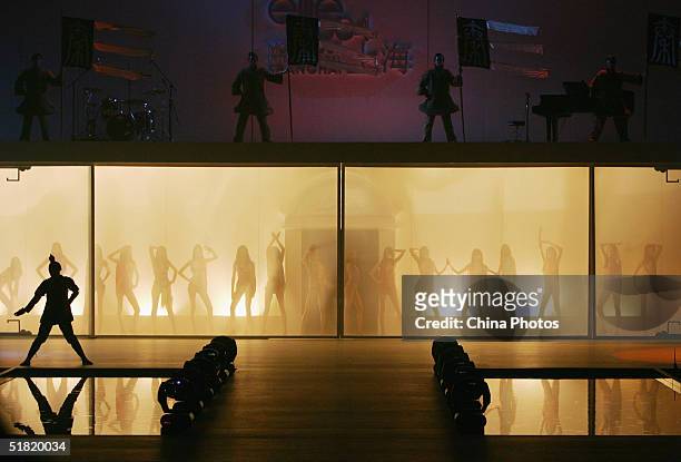 Actors and models perform during the OLAY Elite Model Look 2004 International Finals on December 2, 2004 in Shanghai, China. Sofie Oosterwaalal from...