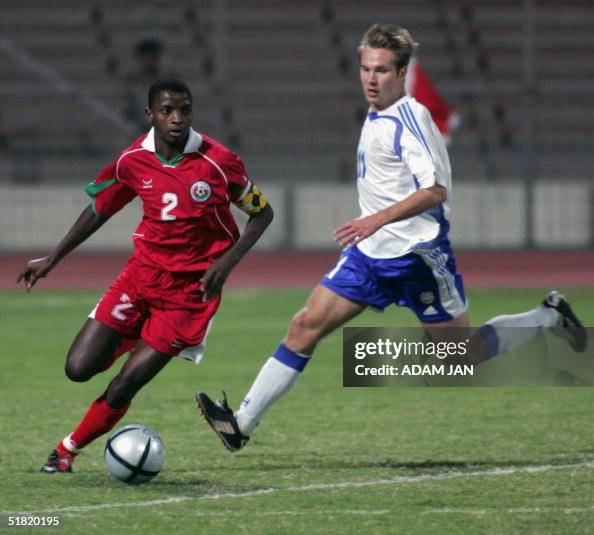 Omani Mohammed Rabia (L) vies with Toni Omani Mohammed Rabia (L) vies with Toni
