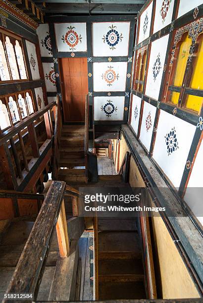 bhutan, trongsa. steep, narrow stairwells in wooden gallery of trongsa dzong. - trongsa district fotografías e imágenes de stock