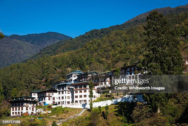 bhutan, trongsa. modern apartment buildings decorated in traditional style. - trongsa district fotografías e imágenes de stock