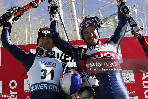 Bode Miller of USA celebrates winning the men's downhill event in the FIS Ski World Cup with second placed Daron Rahlves on December 3, 2004 in...