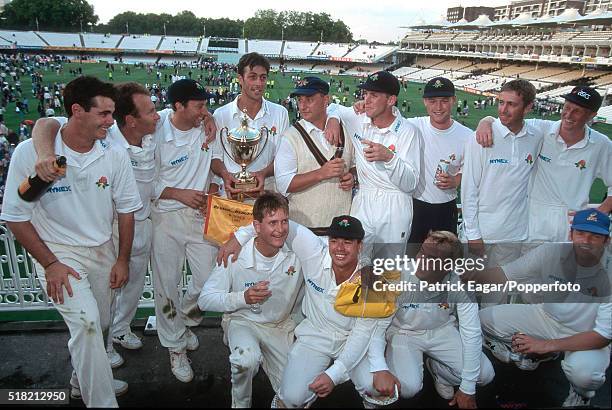 Lancashire captain Mike Watkinson celebrates with his team after winning the Benson and Hedges Cup Final between Kent and Lancashire at Lord's...