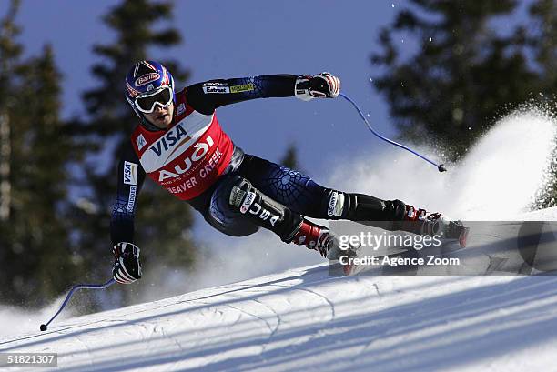 Bode Miller of USA in action during the men's downhill event in the FIS Ski World Cup with second placed Daron Rahlves on December 3, 2004 in Beaver...