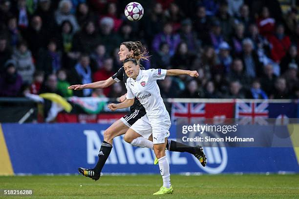 Ali Riley of Rosengard is challenged by Kerstin Garefrekes of Frankfurt during the UEFA Women's Champions League quarter final second leg match...