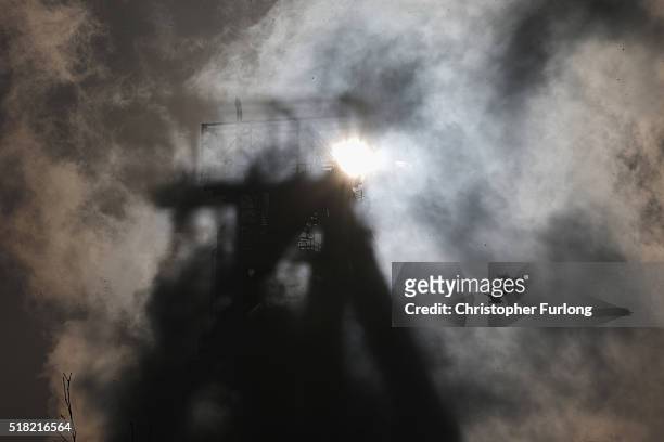 The sun breaks through steam emitting from the Tata Steel plant at Port Talbot on March 30, 2016 in Port Talbot, Wales. Indian owners Tata Steel put...