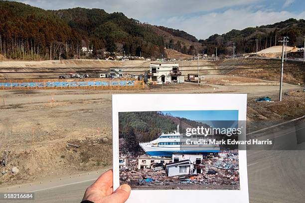 Then and Now" view from a seawall of the building where the Hamayuri was onceperched after being deposited there by the tsunami waves of 3.11. The...
