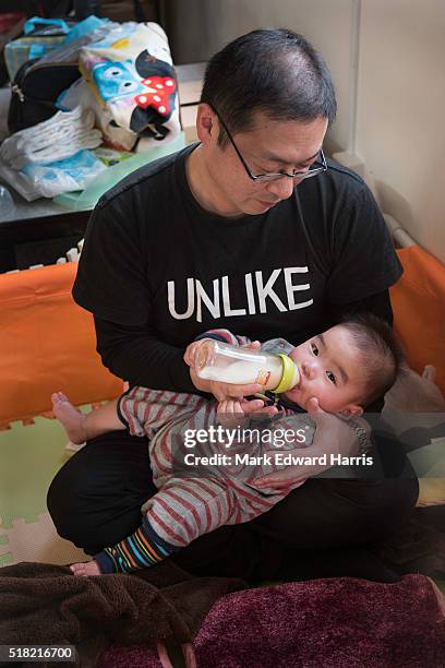 Tsunami survivor Takuya Ueno and his son Sou in the office of Oraga Otsuchi Yume Hiroba in Otsuchi, Japan.