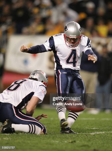 Kicker Adam Vinatieri of the New England Patriots attempts to score off a hold by punter Josh Miller during the game against the Pittsburgh Steelers...