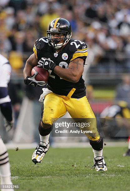 Duce Staley of the Pittsburgh Steelers carries the ball against the New England Patriots during the game at Heinz Field on October 31, 2004 in...