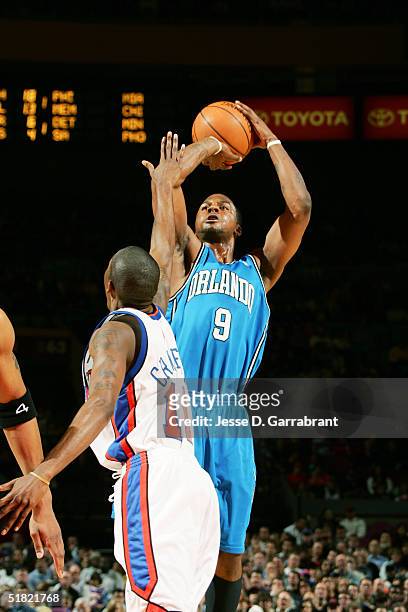 DeShawn Stevenson of the Orlando Magic shoots against Jamal Crawford of the New York Knicks on December 3, 2004 at Madison Square Garden in New York,...