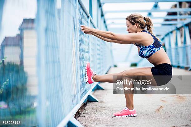 stretching after workout - leg stretch girl stock pictures, royalty-free photos & images