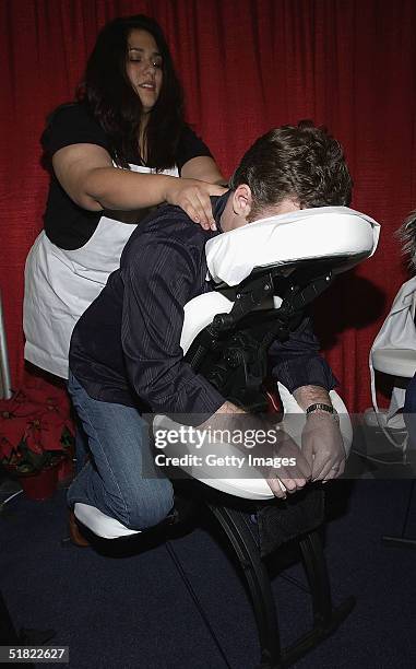 Valentine enjoys a massage from the Blue Spa at the Distinctive Asset Gift Lounge during the KIIS FM Jingle Ball at the Arrowhead Pond on December 3,...