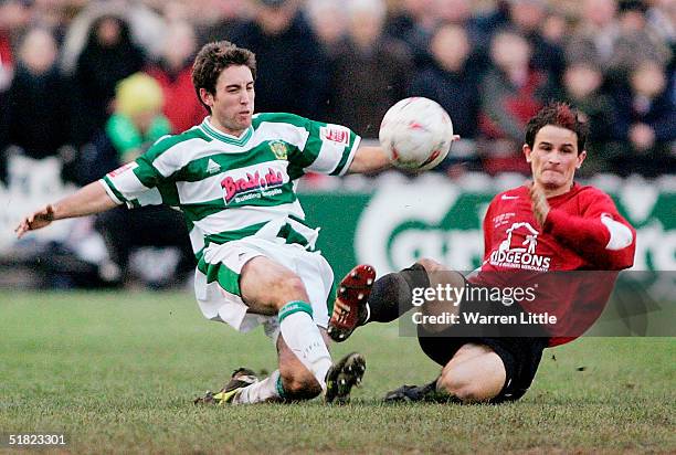 Lee Johnson of Yeovil is tackled by Adrian Cambridge of Histon during the FA Cup second round match between Histon FC and Yeovil Town FC at the...