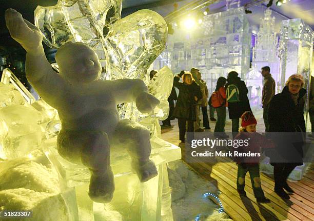 Visitors walk through an exhibition of ice sculptures inspired by Rubens and Antwerp during the Belgian International Snow and Ice Sculpture Festival...