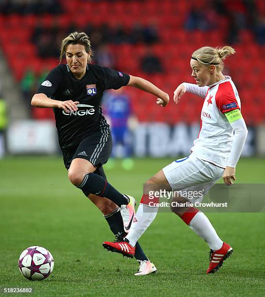 Claire Lavogez of Lyon skips the tackle from Slavia Praha's Blanka Penickova during the UEFA Women's Champions League Second Leg match between Slavia...