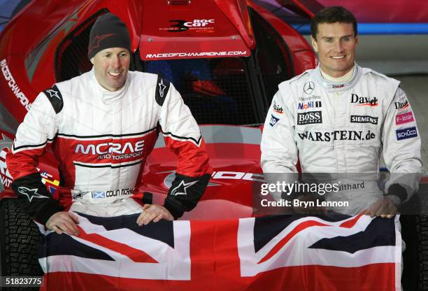 Former World Rally Champion Colin McRae and F1 driver David Coulthard pose for photographers prior to the Race of Champions at the Stade de France on...