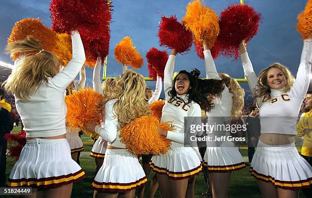 Trojans cheerleaders celebrate the team's 29-24 victory over the UCLA Bruins on December 4, 2004 at the Rose Bowl in Pasadena, California