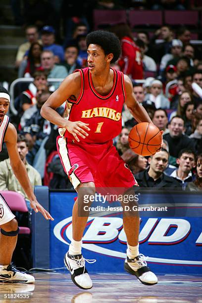 Josh Childress of the Atlanta Hawks looks for the pass against the New Jersey Nets on December 4, 2004 at the Continental Airlines Arena in East...