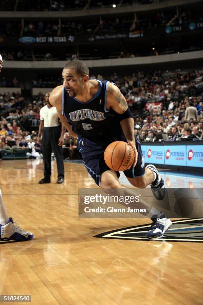 Carlos Boozer of the Utah Jazz drives toward the baseline against the Dallas Mavericks December 4, 2004 at the American Airlines Center in Dallas,...