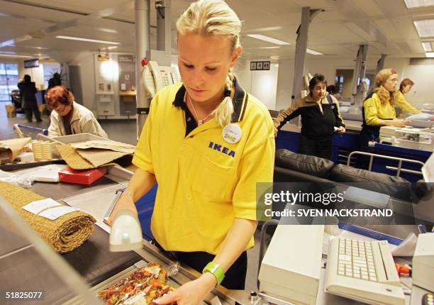 Cashier in first Ikea store in Aelmhult 02 December 2004, that was inagurated in 1958. As a privately held company Ikea manages to avoid publishing...