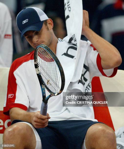 World Number two Andy Roddick concentrates between games in his Davis Cup final third single match against World number five and 1998 French Open...