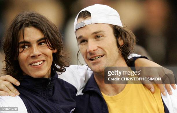 World number five and 1998 French Open champion Carlos Moya of Spain jubilates with Rafael Nadal of Spain, the youngest Davis Cup winner in the...