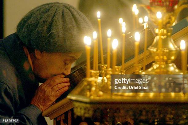 An Orthodox Christian woman attends church December 5, 2004 in Donetsk, Ukraine. The city, with a population of over 1 million is situated in the...