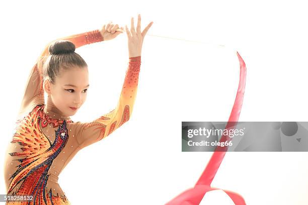 girl is engaged in rhythmic gymnastics - rhythmic gymnastics stock pictures, royalty-free photos & images