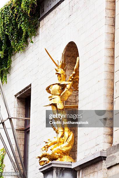 golden archangel michael and evil - archangel michael sword stock pictures, royalty-free photos & images