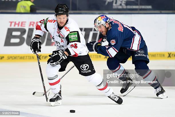 Patrick Hager of the Koelner Haien and Jason Jaffray of EHC Red Bull Muenchen during the game between the EHC Red Bull Muenchen and Koelner Haie on...