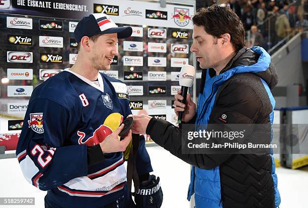 Anchorman Hans Finger and Frank Mauer of EHC Red Bull Muenchen with the Man of the Day medal after the game between the EHC Red Bull Muenchen and...