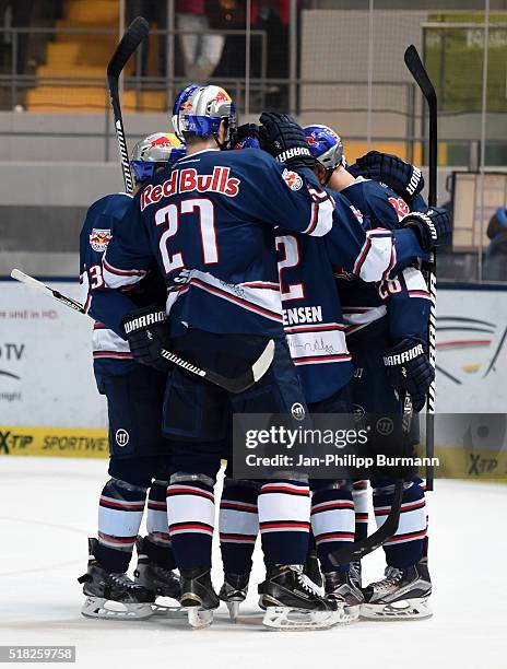 Frederic St-Denis, Matthew Smaby, Mads Christensen and Frank Mauer of EHC Red Bull Muenchen celebratesn das Tor tom 3:1 during the game between the...