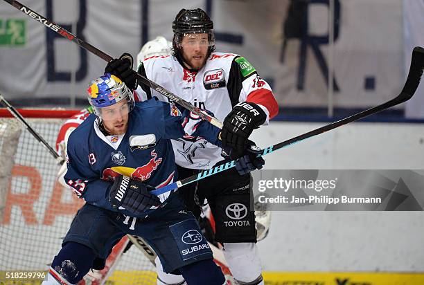 Maximilian Kastner of EHC Red Bull Muenchen and Nickolas Latta of the Koelner Haie during the game between the EHC Red Bull Muenchen and Koelner Haie...