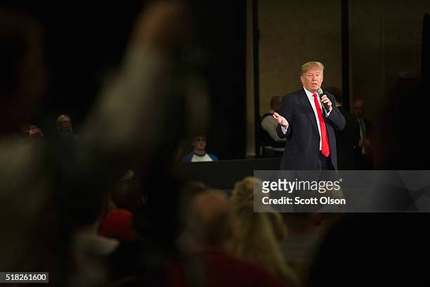 Republican presidential candidate Donald Trump speaks to guests during a campaign rally at the Radisson Paper Valley Hotel on March 30, 2016 in...