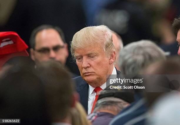 Republican presidential candidate Donald Trump greets guests following a campaign rally at the Radisson Paper Valley Hotel on March 30, 2016 in...