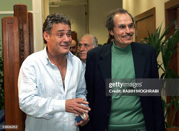 Egyptian film stars Faruq al-Fishawi and Ezzat al-Alayli arrive 05 December 2004 at Dubai airport to attend the Dubai International Film Festival....