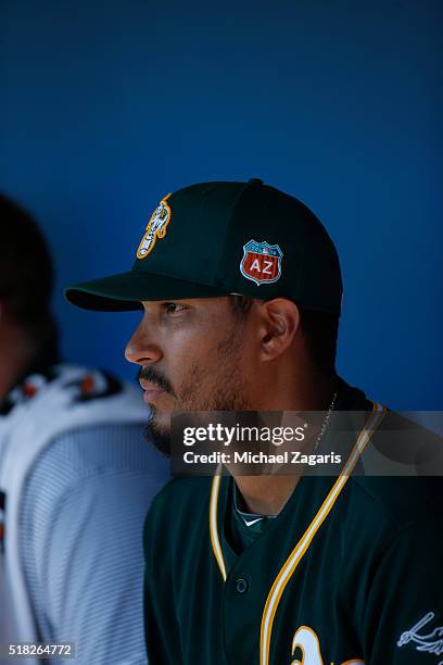 Felix Doubront of the Oakland Athletics sits in the dugout during a spring training game against the Chicago White Sox at Camelback Ranch on March...