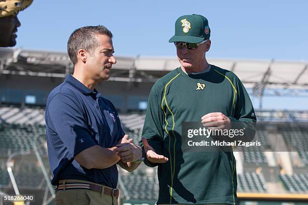 Network's Matt Vasgersian talks with Manager Bob Melvin of the Oakland Athletics in the field prior to a spring training game between the Athletics...